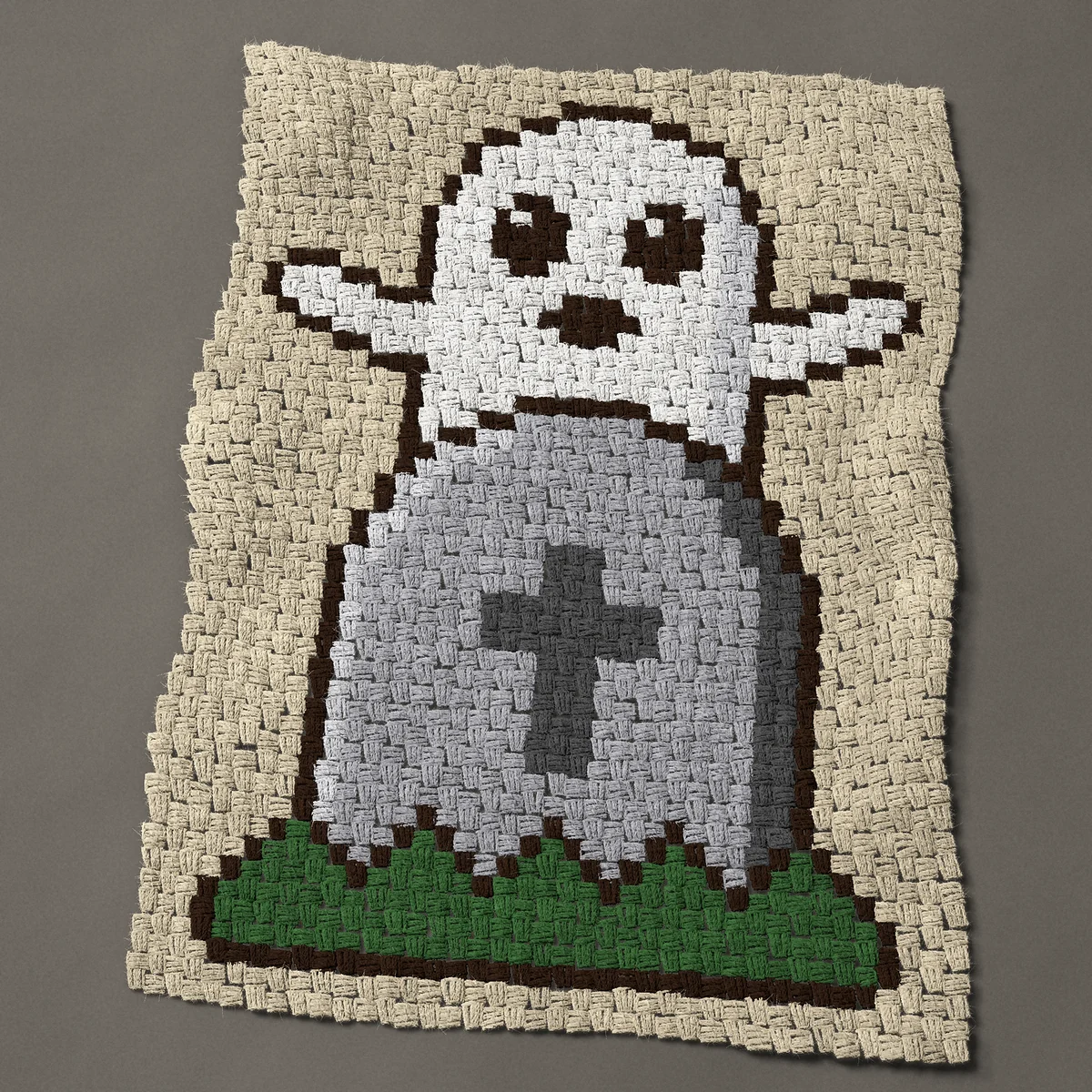 A baby blanket worked corner to corner, 29¼ by 39 inches: Halloween ghost popping up behind a gravestone, 39 by 52 blocks