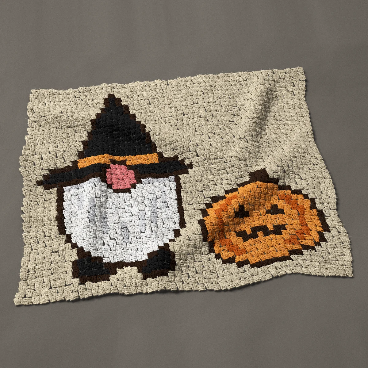 A baby blanket worked corner to corner, 38 by 32¼ inches: Halloween gnome in a witch hat with a carved pumpkin, 51 by 43 blocks