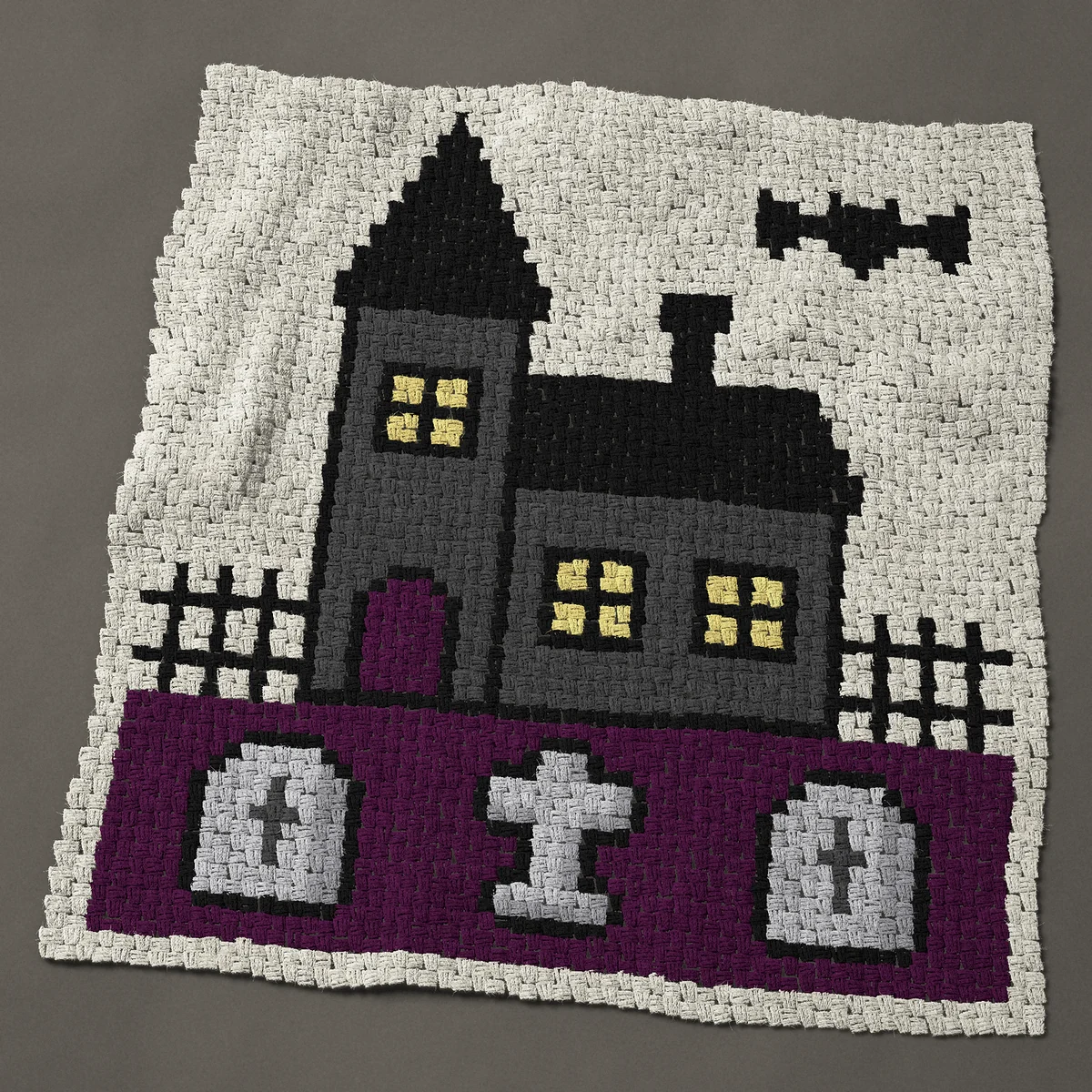 A panel worked corner to corner, 45½ by 49½ inches: Haunted house with a graveyard and three gravestones, 61 by 66 blocks