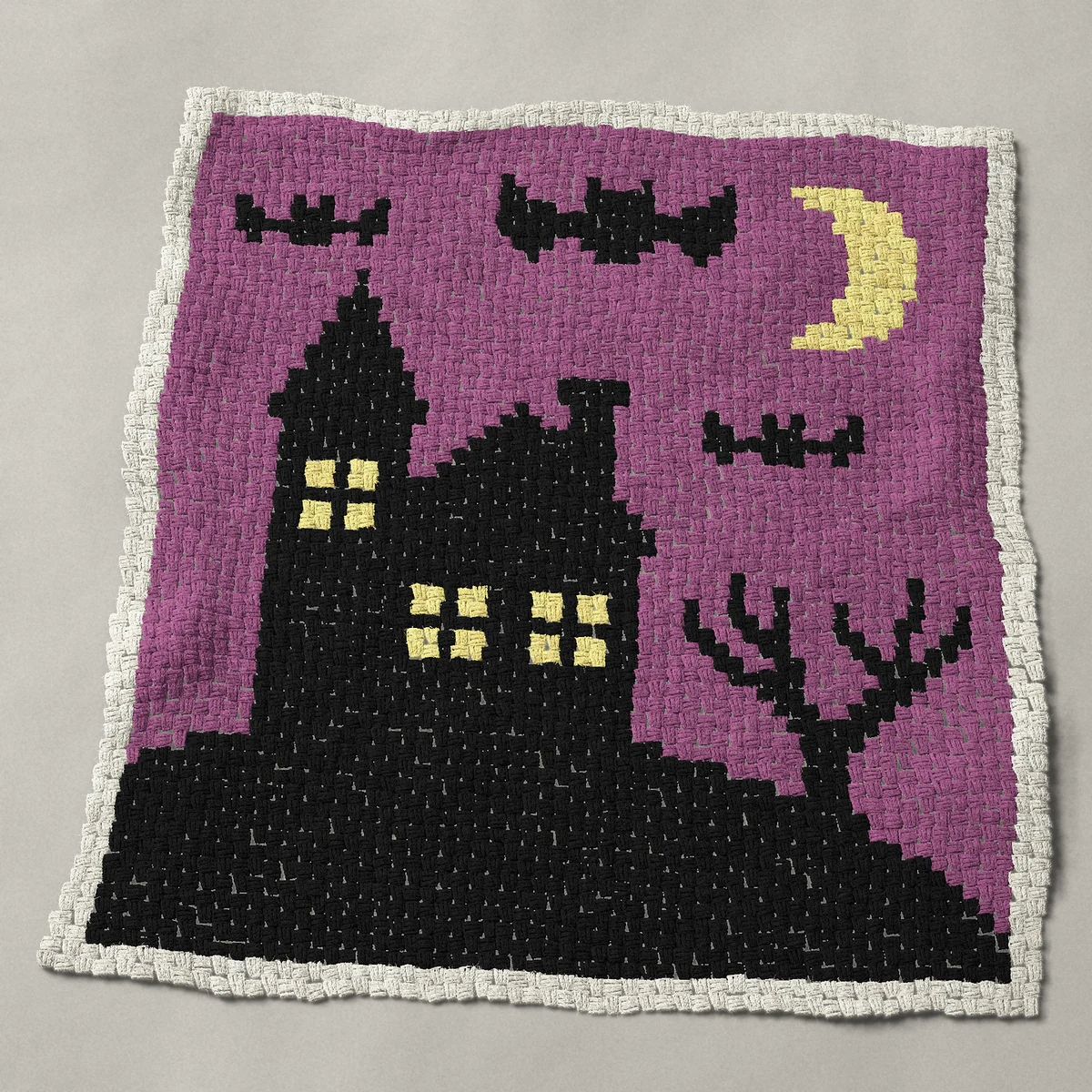 A panel worked corner to corner, 45½ by 48½ inches: Haunted house on a hill with a crescent moon and bats, 61 by 65 blocks