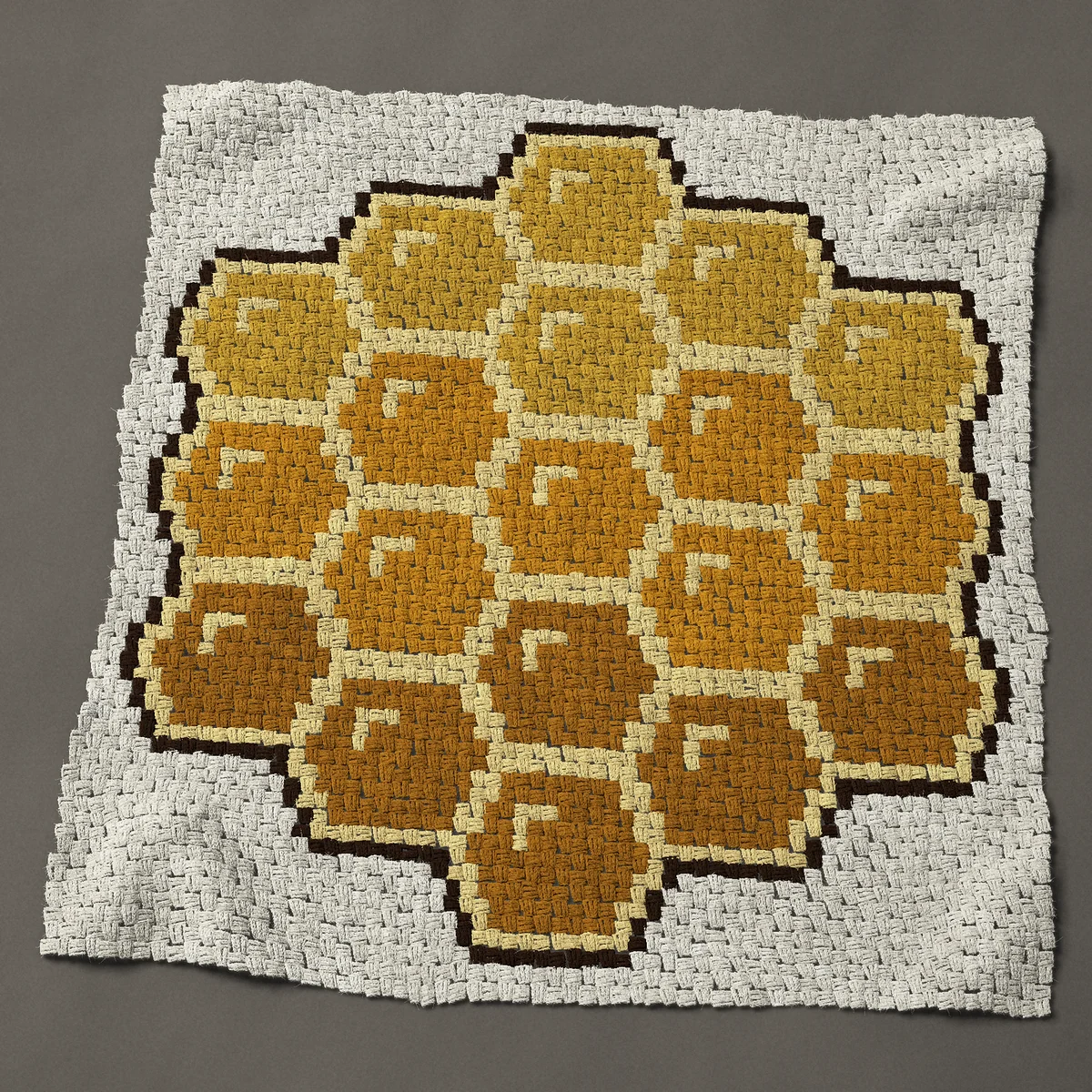 A panel worked corner to corner, 48 by 49½ inches: Honeycomb of nineteen hexagon cells in three golds, 64 by 66 blocks
