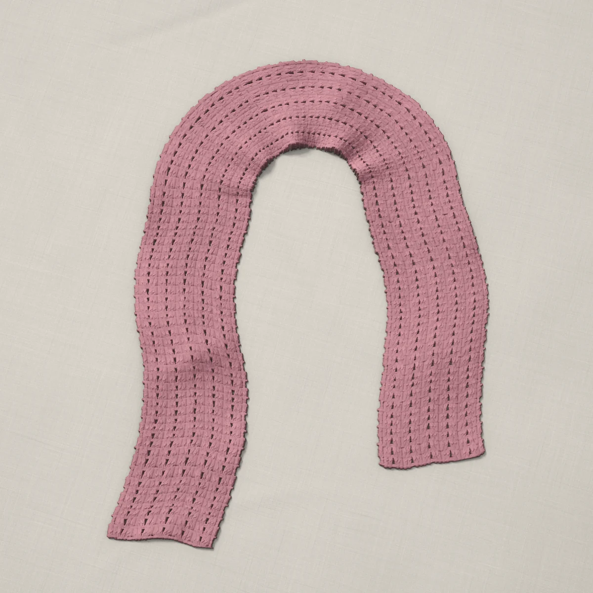 A scarf in iris stitch, 6.5 by 60.3 inches, lying in a loose bend