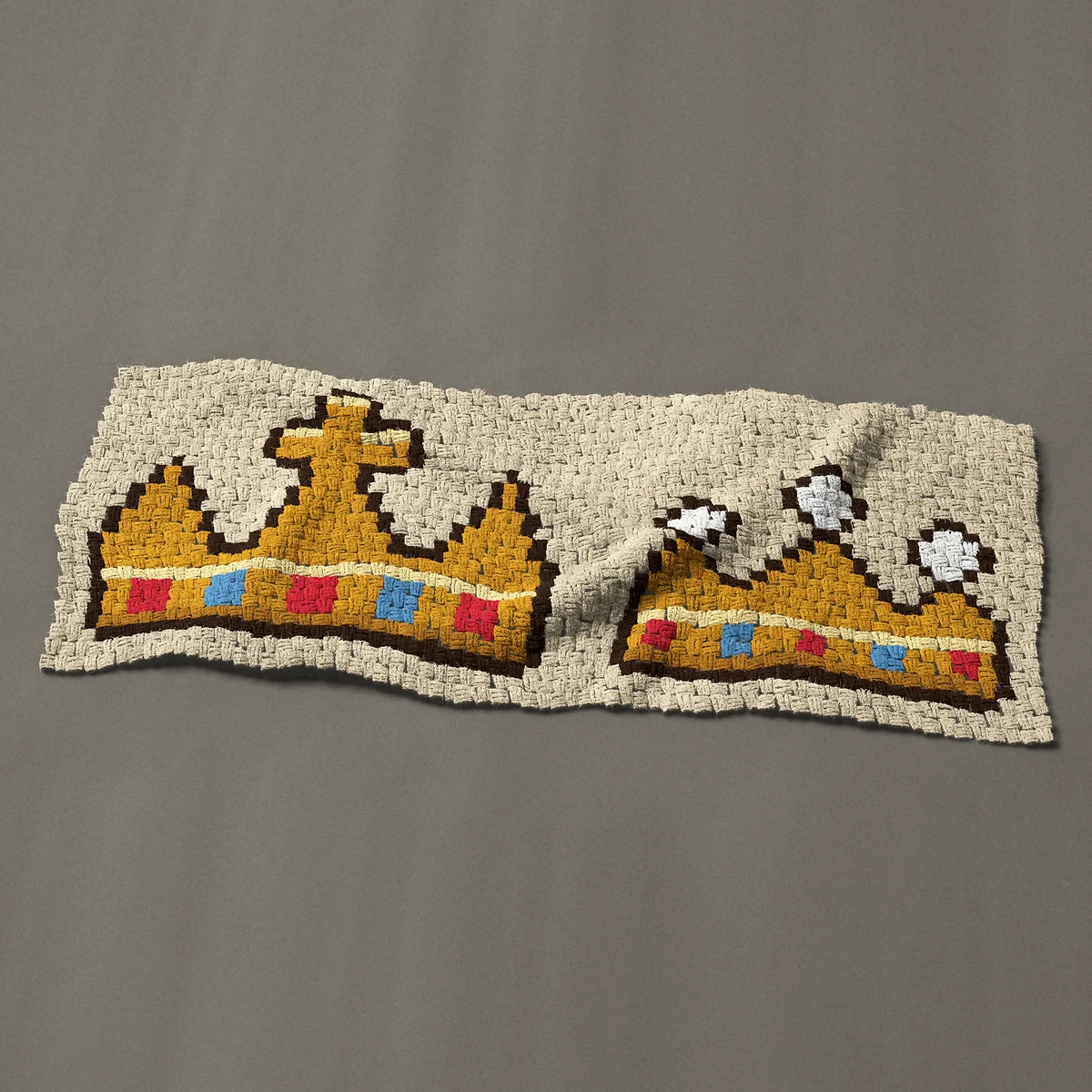 A panel worked corner to corner, 51 by 20¼ inches: King and queen gold crowns side by side, 68 by 27 blocks