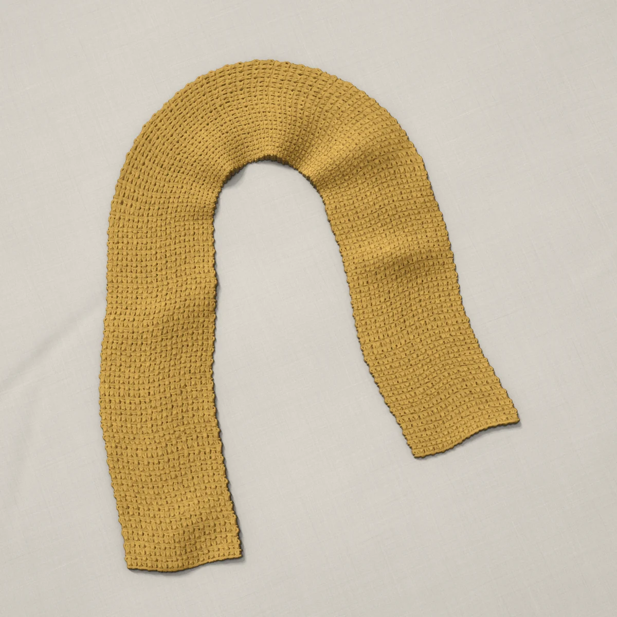 A scarf in lemon peel stitch, 6¾ by 60 inches, lying in a loose bend