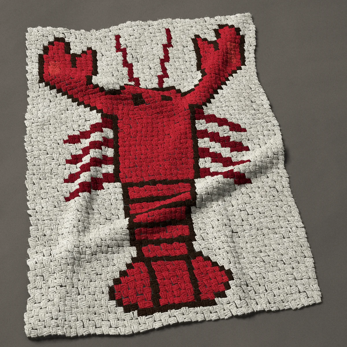 A baby blanket worked corner to corner, 33¾ by 48½ inches: Lobster seen from above, red with both claws open, 45 by 65 blocks