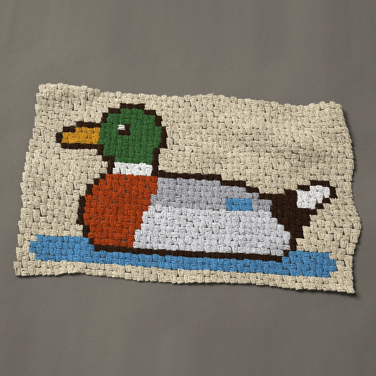 A panel worked corner to corner, 38 by 24 inches: Mallard duck swimming, a drake with a green head, 51 by 32 blocks