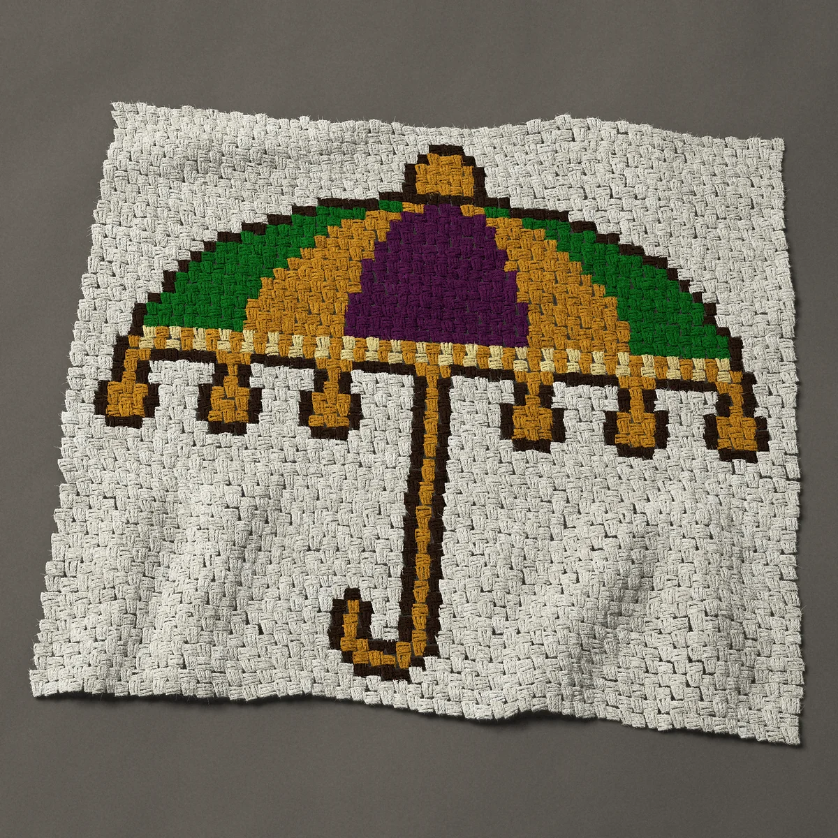 A baby blanket worked corner to corner, 42½ by 38 inches: Mardi Gras parade umbrella in purple, green and gold, 57 by 51 blocks