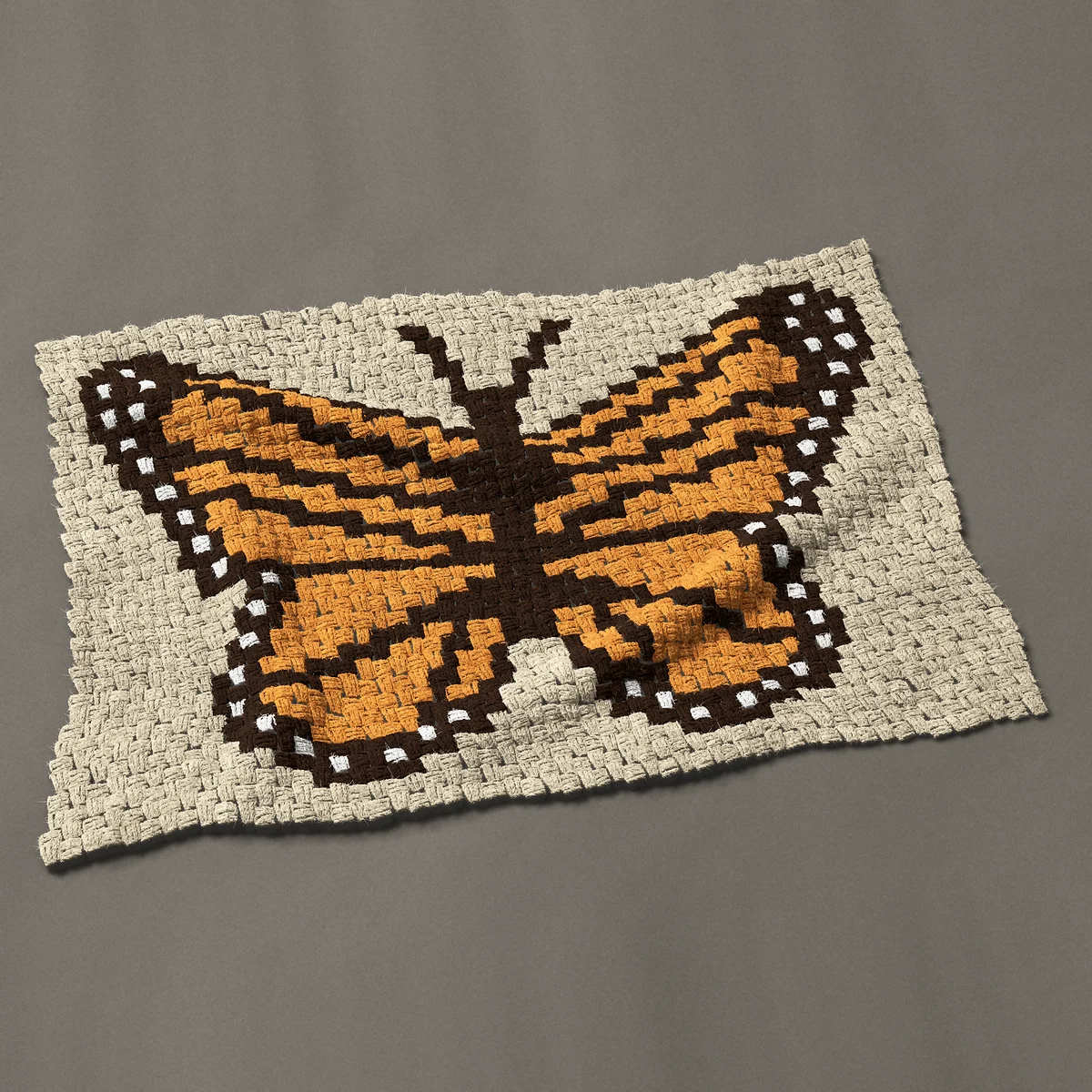 A baby blanket worked corner to corner, 41 by 27¾ inches: Monarch butterfly with wings spread, 55 by 37 blocks