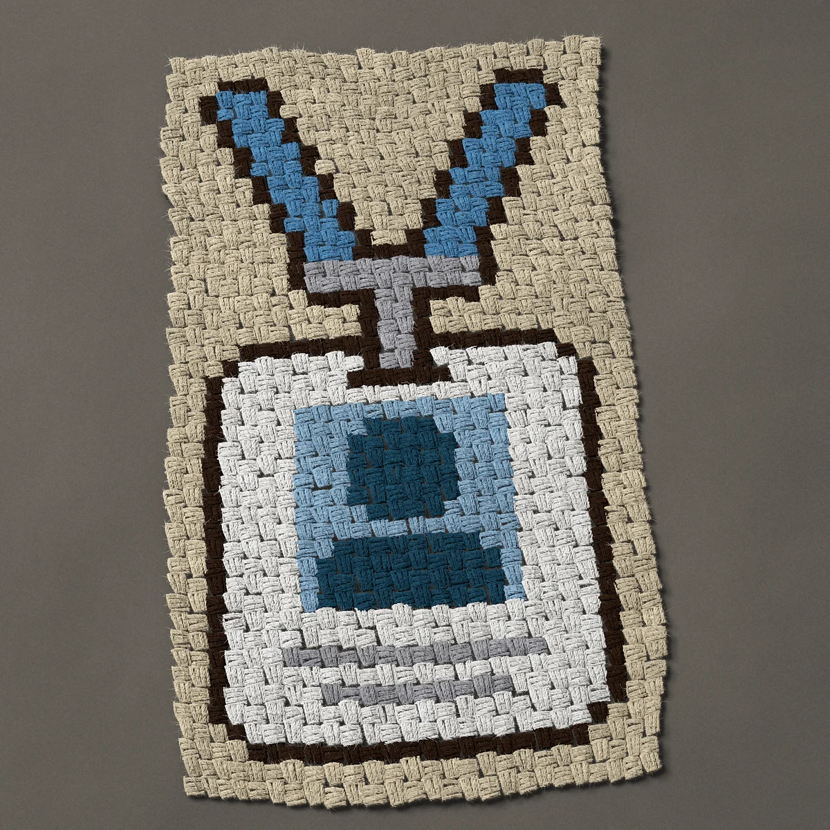 A panel worked corner to corner, 19½ by 34½ inches: ID badge on a blue lanyard for a new job, 26 by 46 blocks