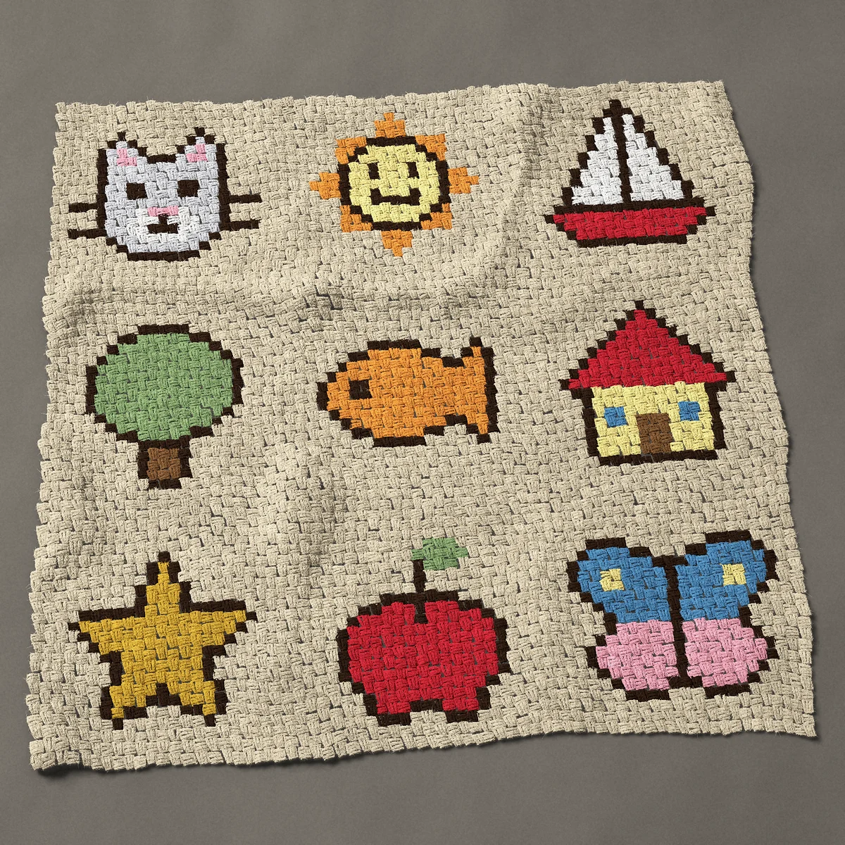 A throw worked corner to corner, 51½ by 50 inches: Kids sampler of nine pictures: cat, sun, boat, fish, 69 by 67 blocks