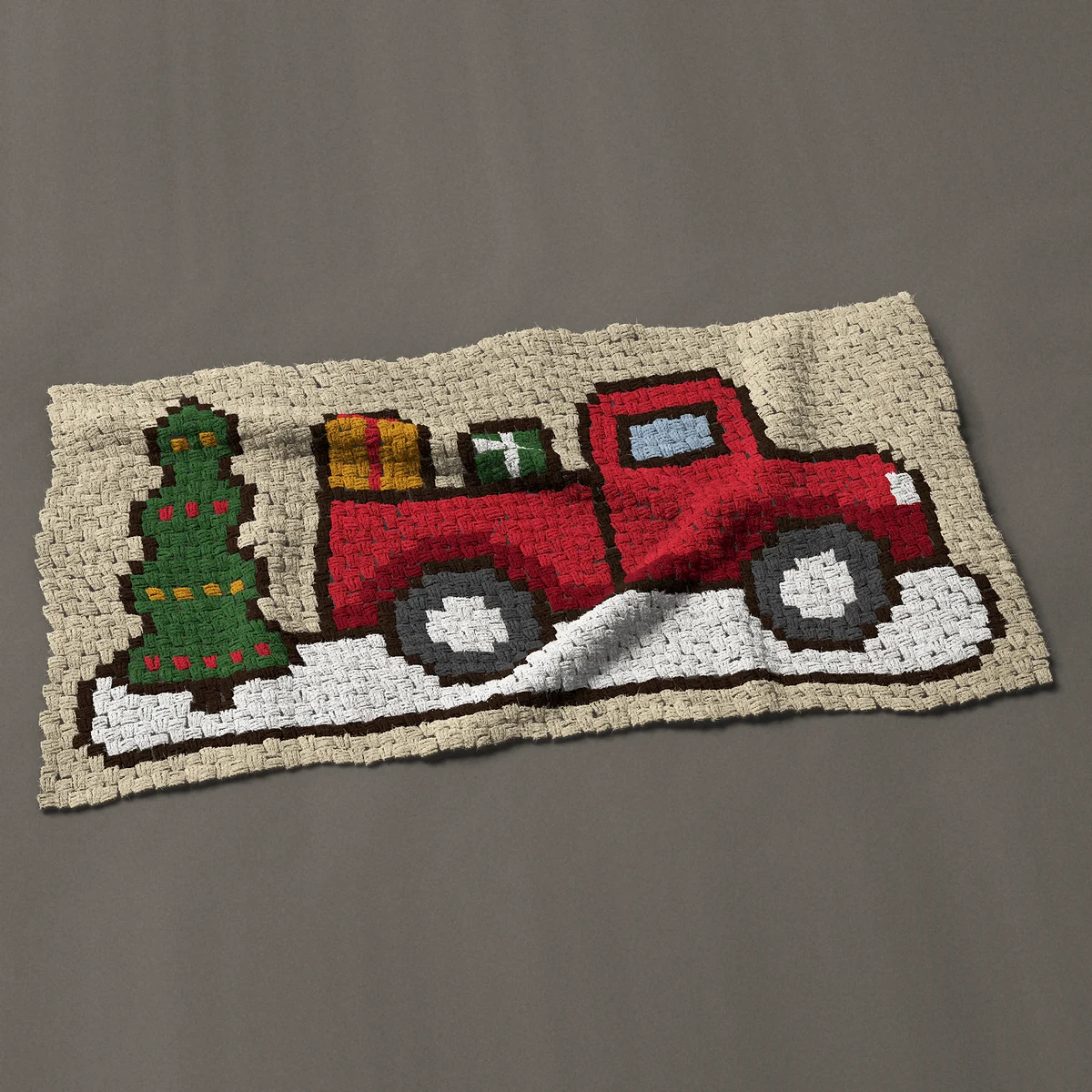A baby blanket worked corner to corner, 51 by 26¼ inches: Old fashioned red truck with gifts and a Christmas tree, 68 by 35 blocks