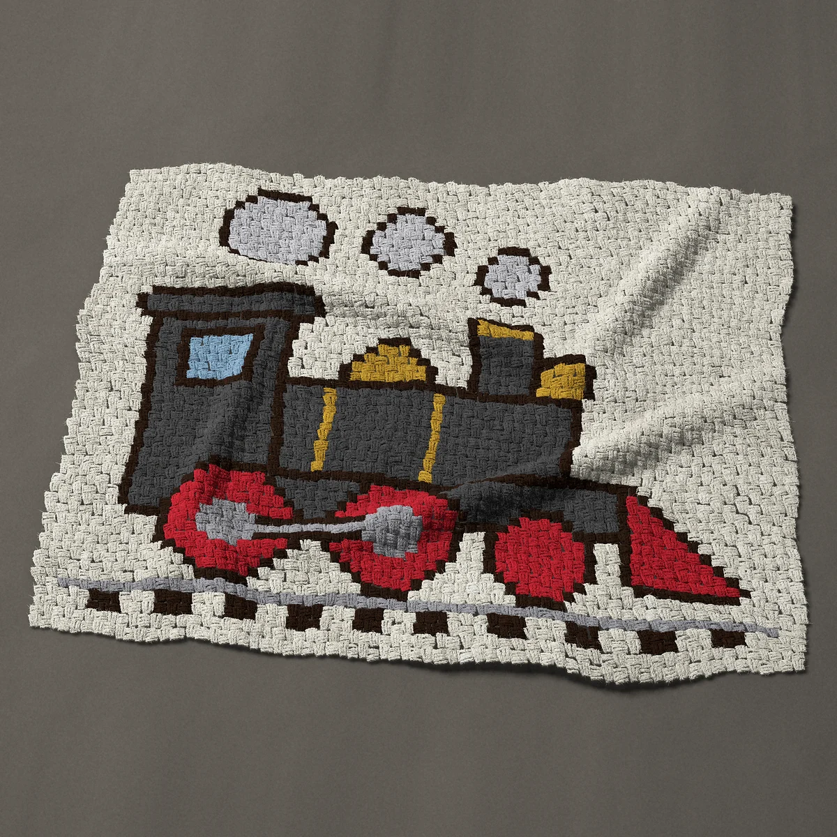 A baby blanket worked corner to corner, 50 by 40½ inches: Old steam train locomotive with red wheels, 67 by 54 blocks