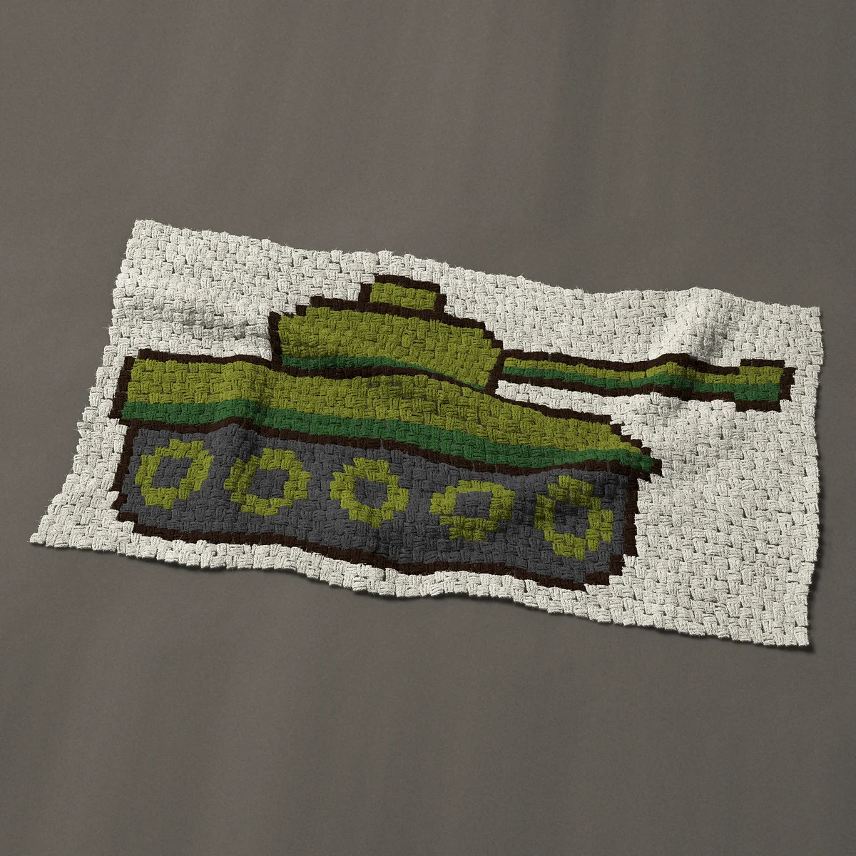 A baby blanket worked corner to corner, 49½ by 26¼ inches: Olive green army tank, a military tank in side view, 66 by 35 blocks