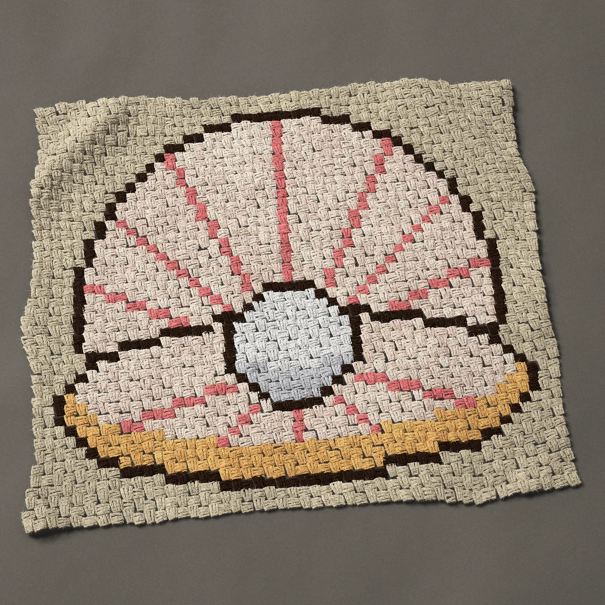 A baby blanket worked corner to corner, 36¾ by 32¼ inches: Open seashell with a white pearl inside, 49 by 43 blocks