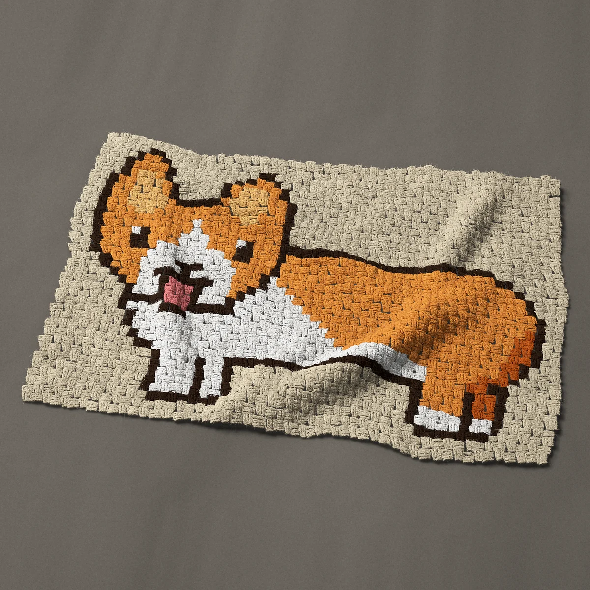 A baby blanket worked corner to corner, 39½ by 27 inches: Cute orange and white corgi with its tongue out, 53 by 36 blocks
