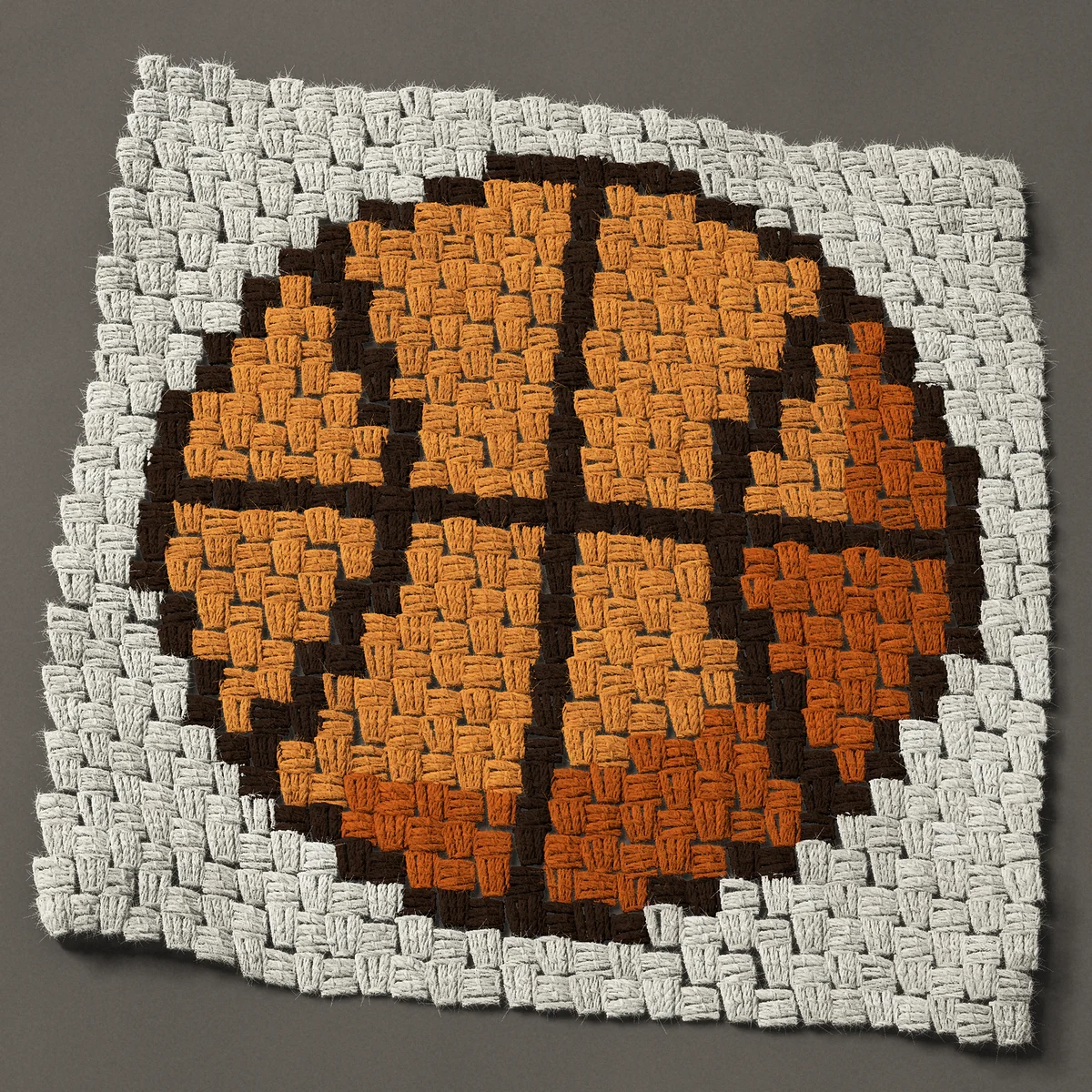 A panel worked corner to corner, 21¾ by 21¾ inches: Orange basketball with dark seams, 29 by 29 blocks
