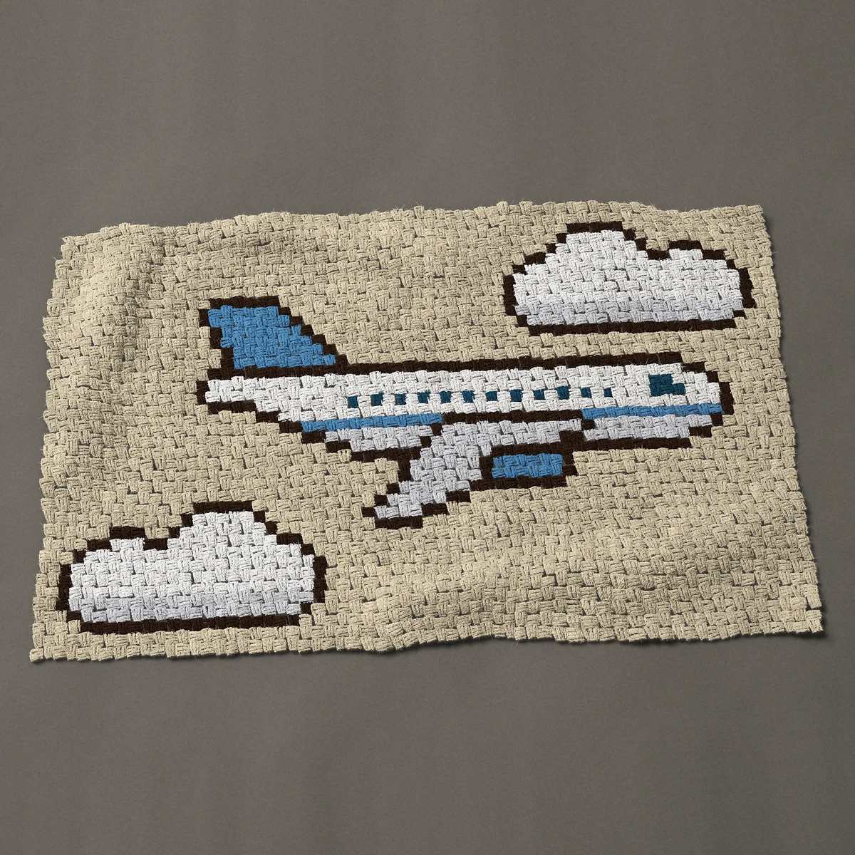 A baby blanket worked corner to corner, 48 by 30 inches: Passenger jet airplane between two clouds, 64 by 40 blocks