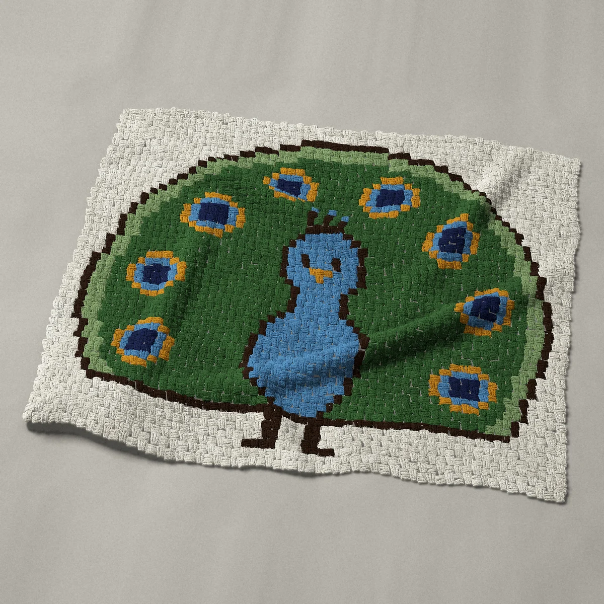 A baby blanket worked corner to corner, 45½ by 38 inches: Peacock with a fanned tail facing forward, 61 by 51 blocks