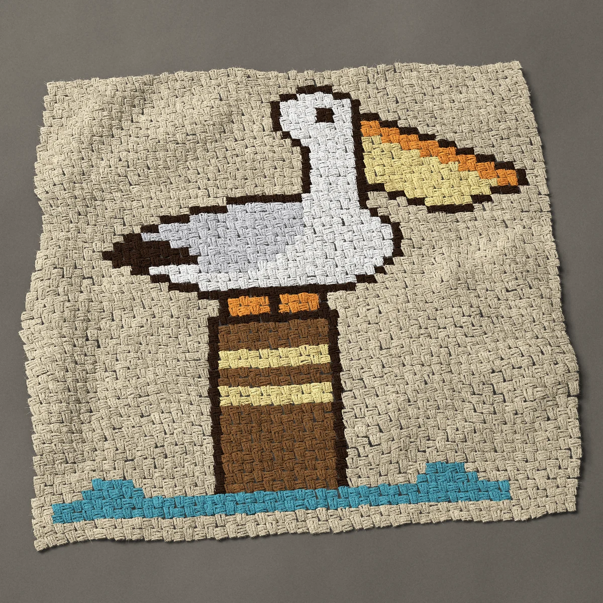 A baby blanket worked corner to corner, 40½ by 39½ inches: White pelican perched on a wooden dock post, 54 by 53 blocks