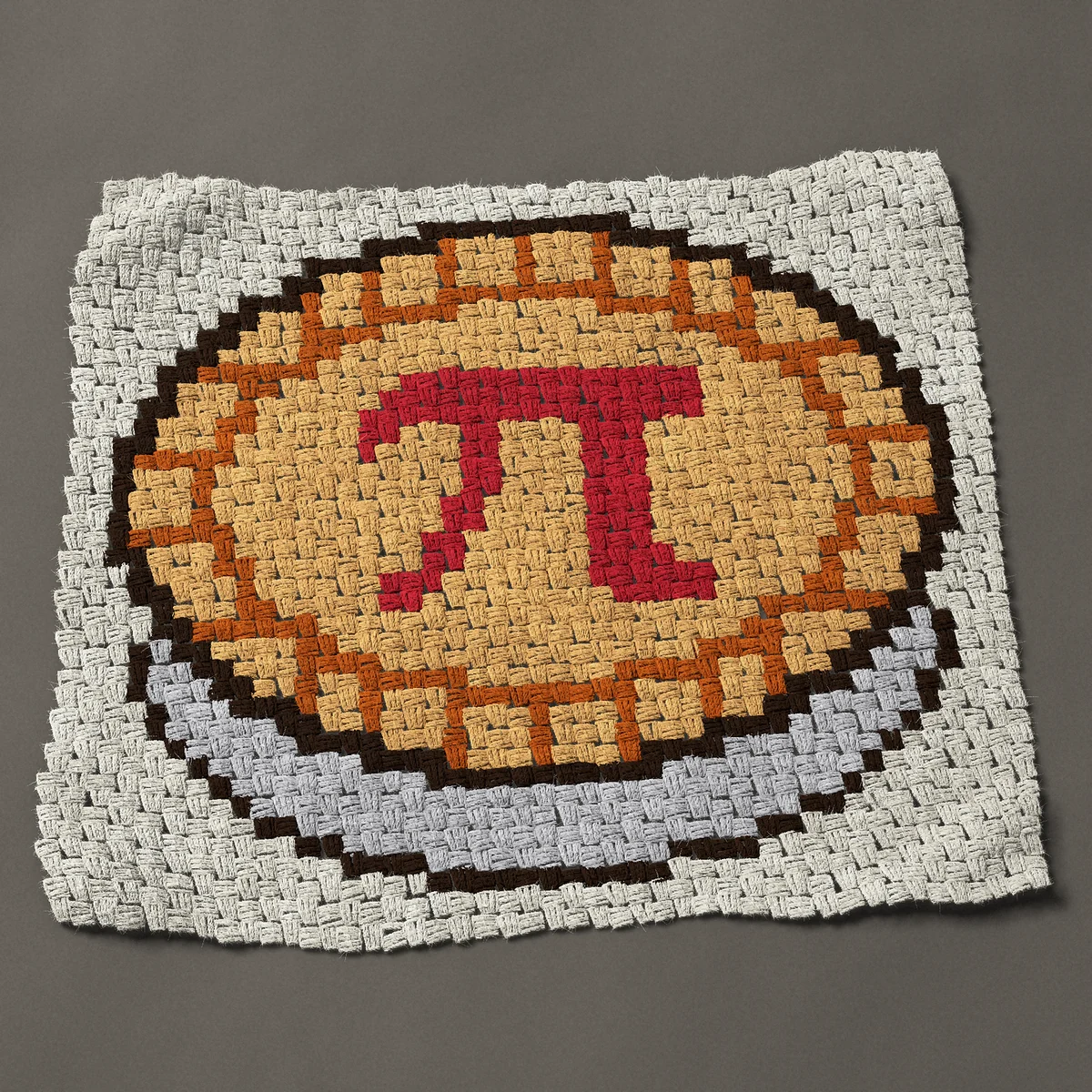 A panel worked corner to corner, 33¾ by 30 inches: Pi Day pie with a red pi symbol cut in the crust, 45 by 40 blocks