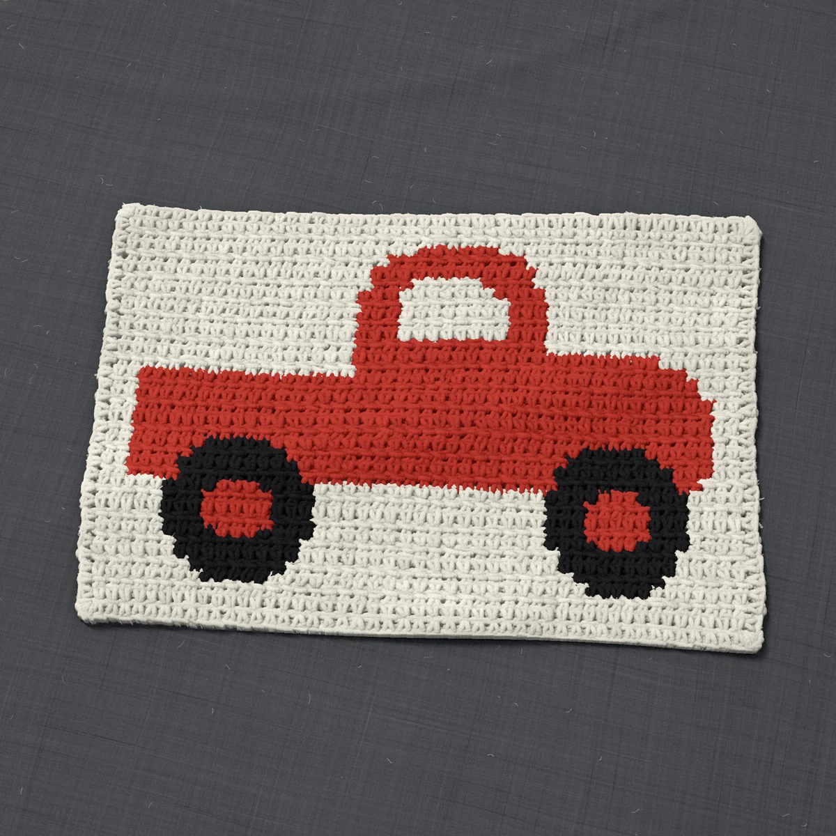 A panel in single crochet, 14.5 by 9.3 inches: a pickup truck in red and black on a cream ground, 47 stitches by 35 rows