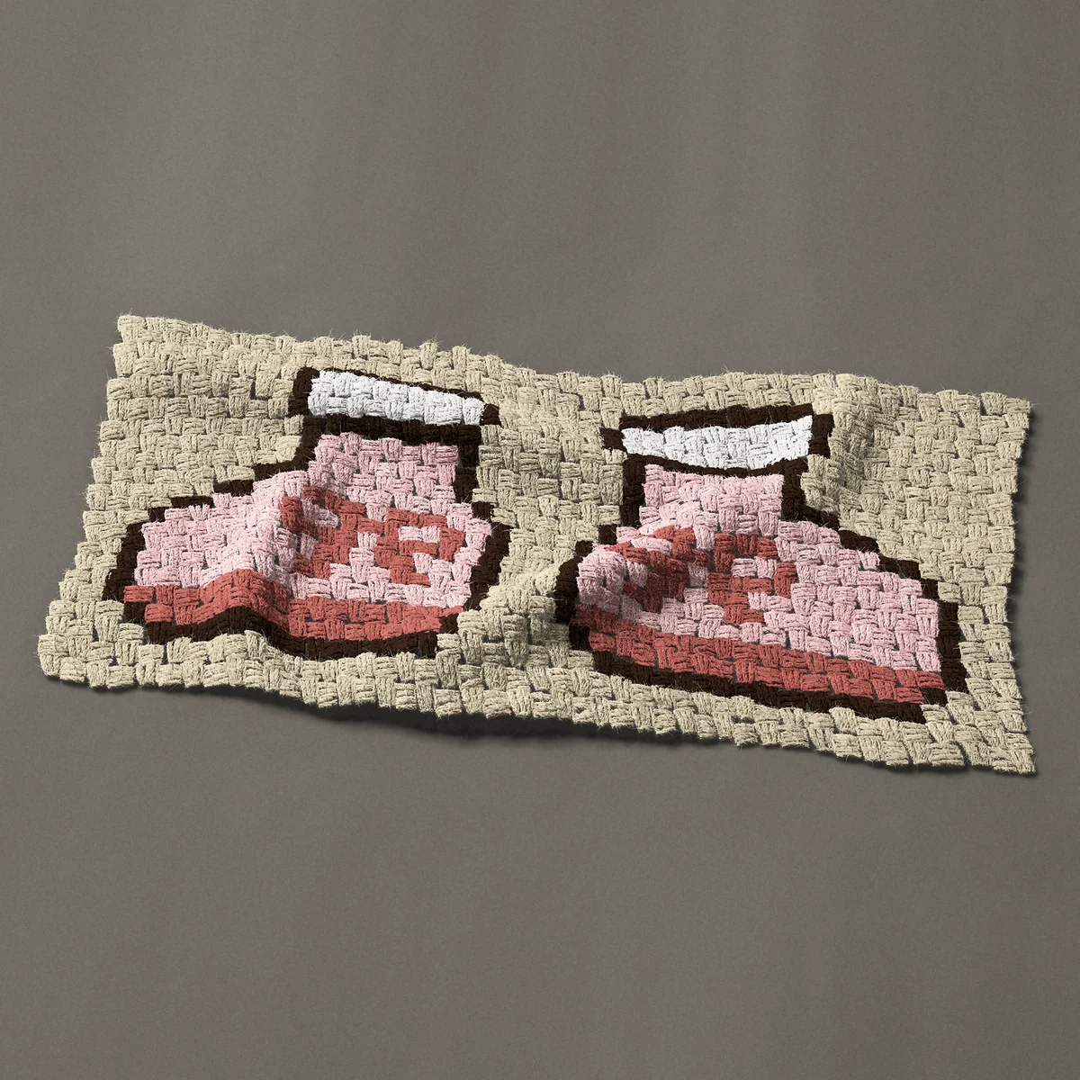 A panel worked corner to corner, 33¾ by 16½ inches: Pink baby booties with white cuffs and ribbon bows, 45 by 22 blocks