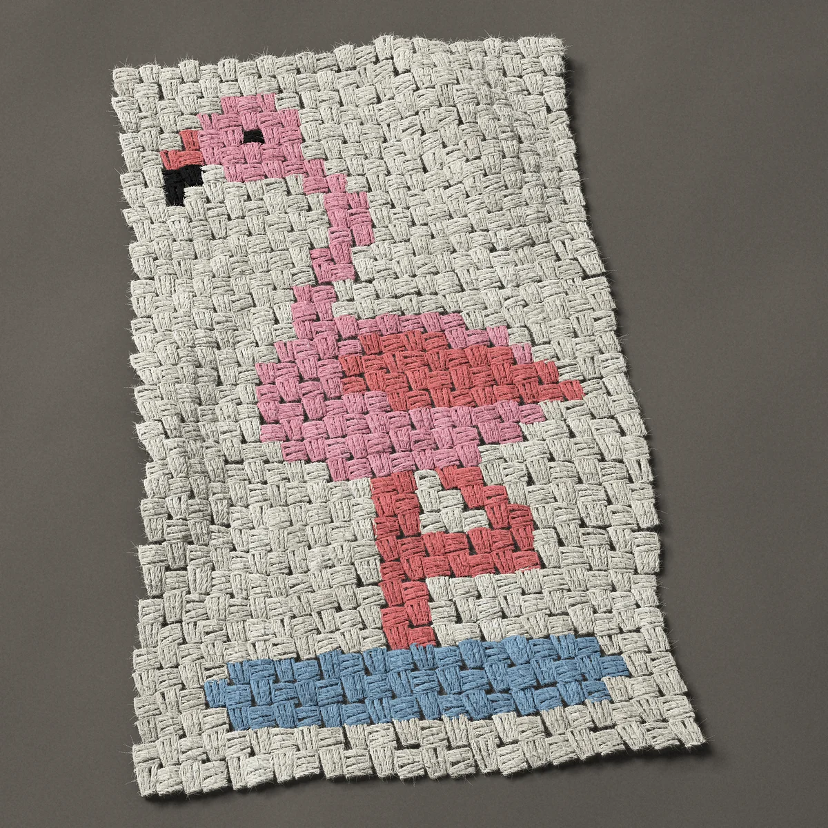 A panel worked corner to corner, 17¼ by 27 inches: Pink flamingo standing on one leg, 23 by 36 blocks