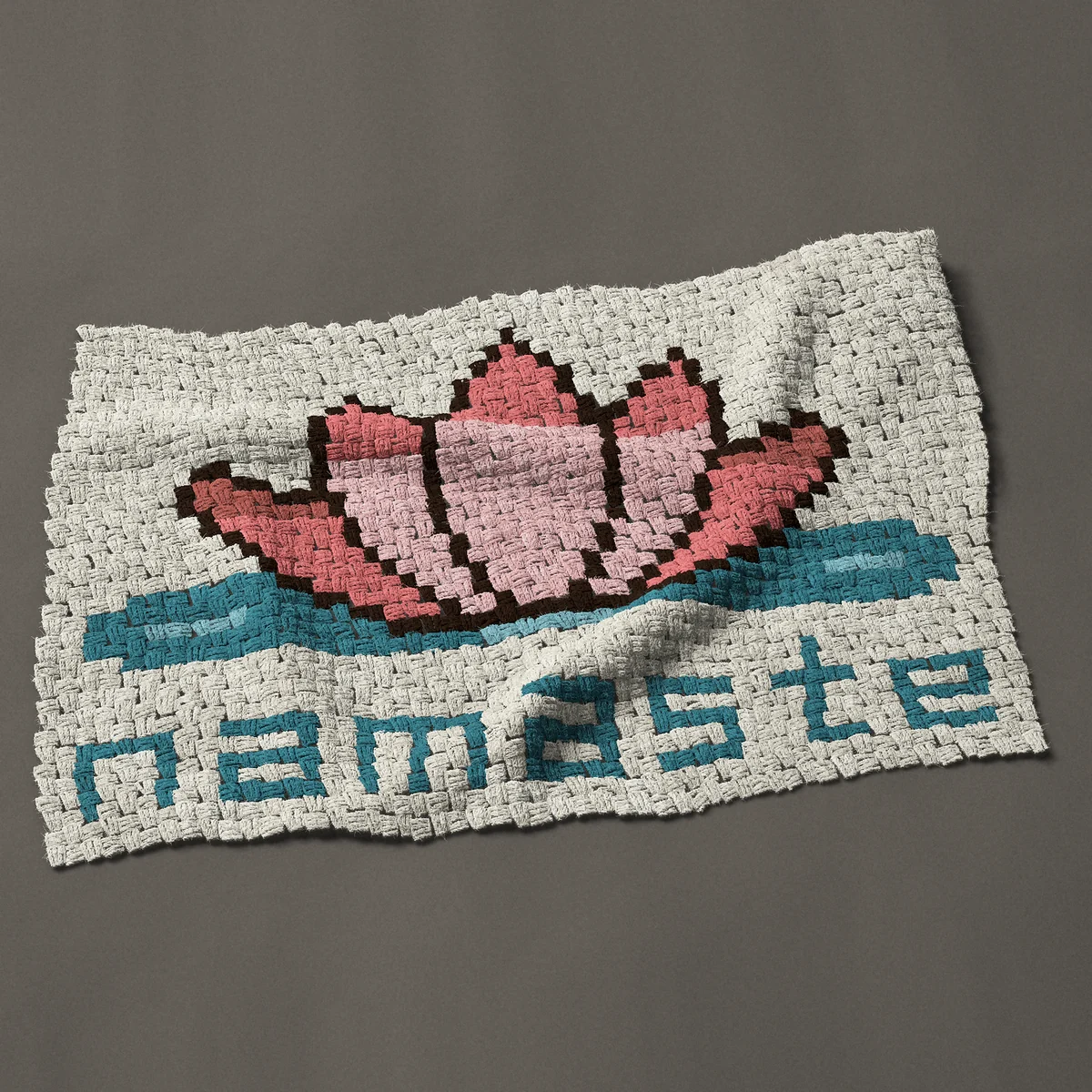 A baby blanket worked corner to corner, 39½ by 26¼ inches: Namaste lotus flower: a pink lotus on the water, 53 by 35 blocks