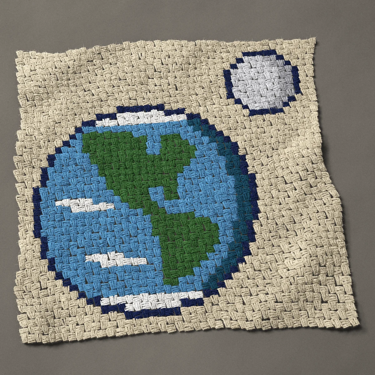 A panel worked corner to corner, 32¼ by 32¼ inches: Planet Earth from space with the Moon, 43 by 43 blocks