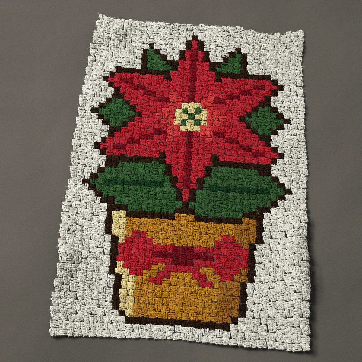 A baby blanket worked corner to corner, 26¼ by 39½ inches: Potted red poinsettia in a gold pot with a red bow, 35 by 53 blocks