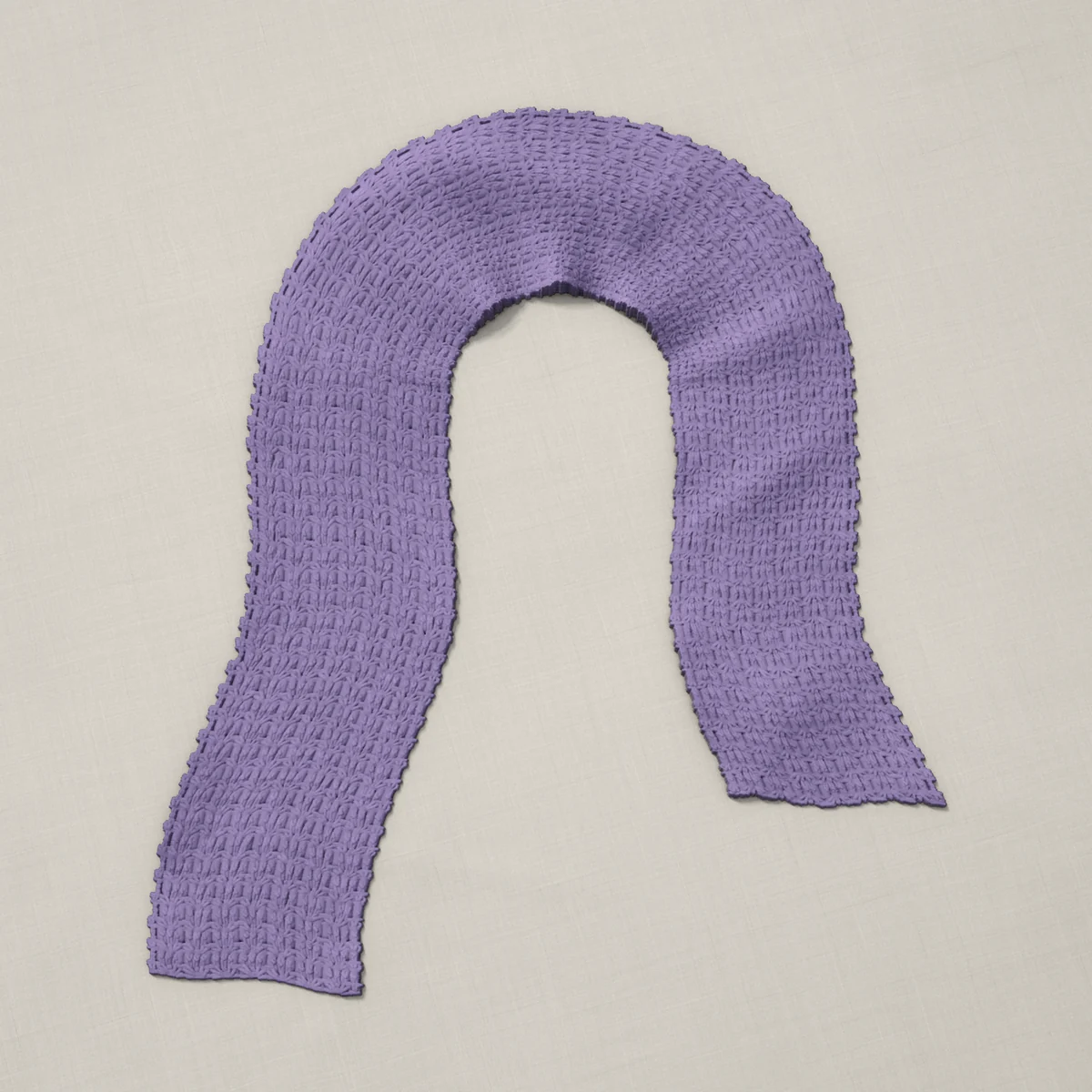 A scarf in primrose stitch, 7 by 60½ inches, lying in a loose bend
