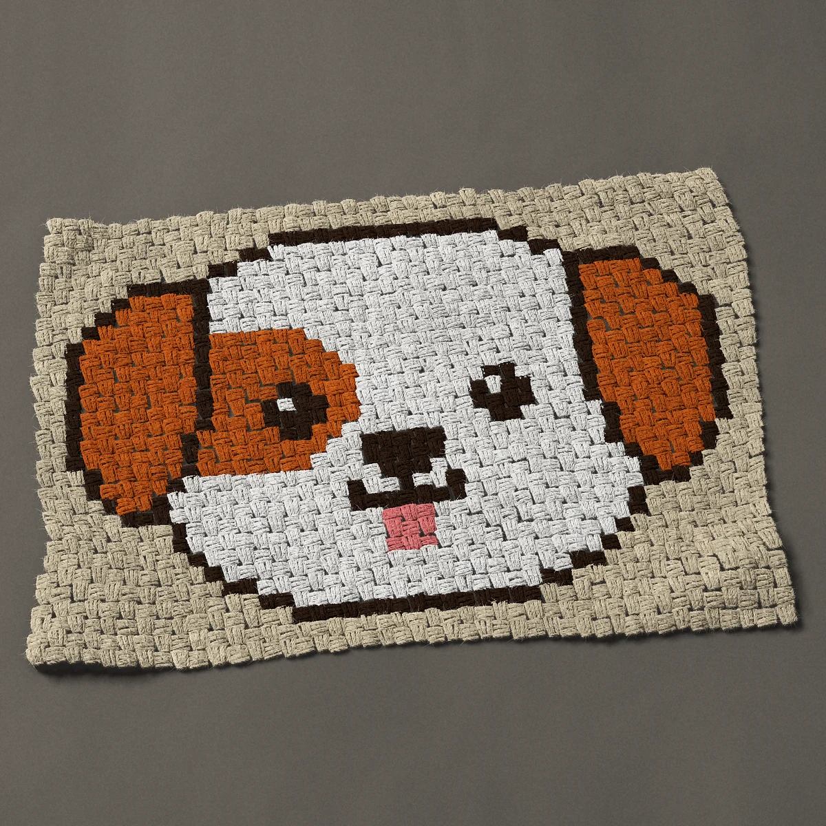A panel worked corner to corner, 33¾ by 23¼ inches: Puppy face with a brown patch over one eye, 45 by 31 blocks