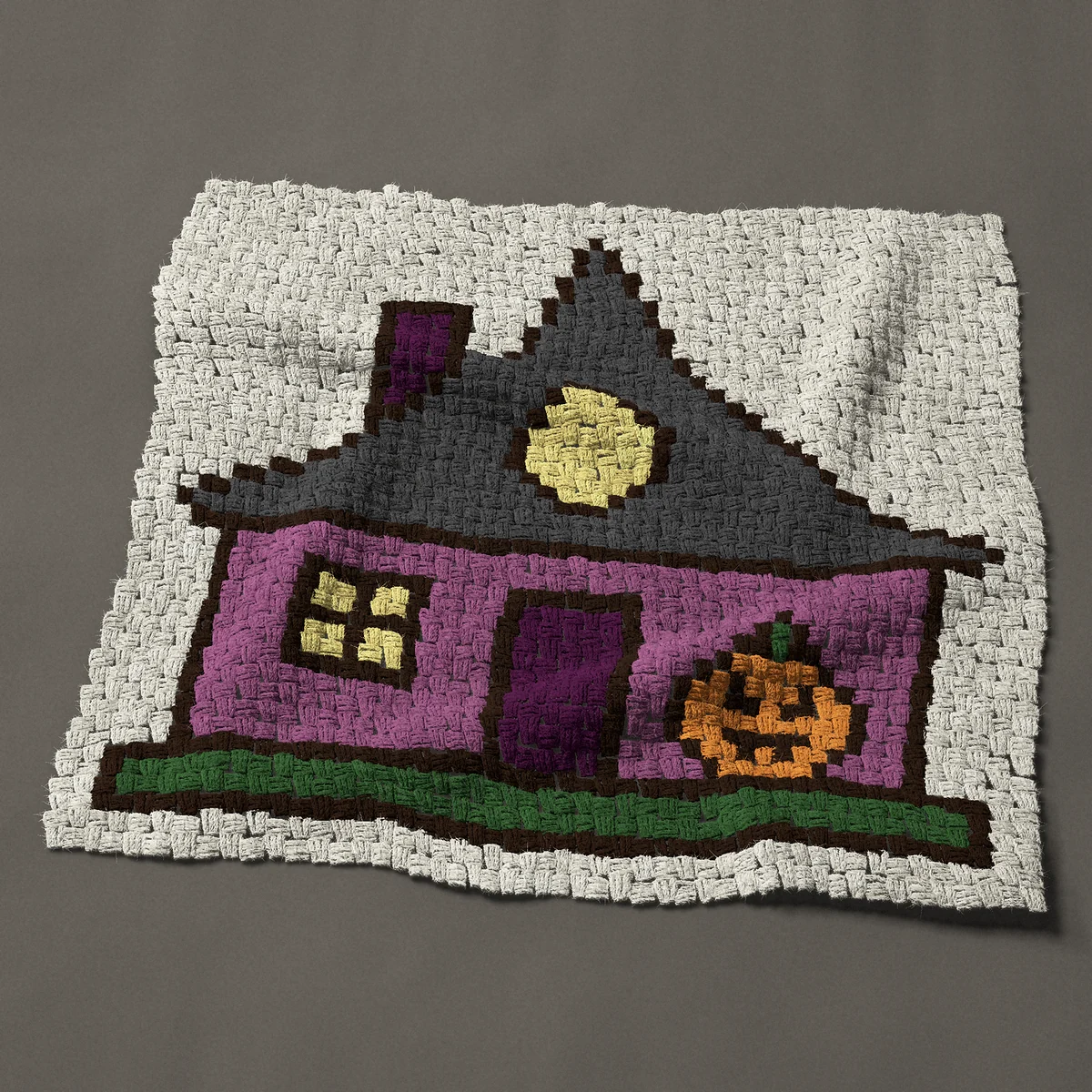 A baby blanket worked corner to corner, 36¾ by 33¾ inches: Purple Halloween cottage with a jack o lantern, 49 by 45 blocks