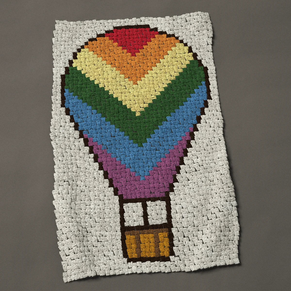 A baby blanket worked corner to corner, 29¼ by 47 inches: Rainbow hot air balloon with chevron stripes, 39 by 63 blocks