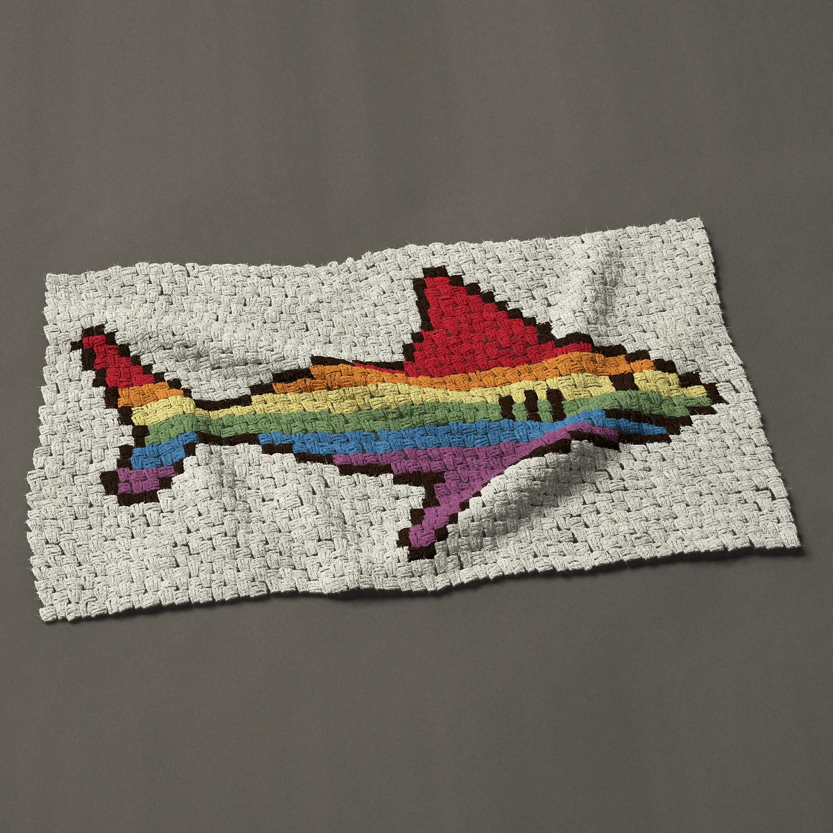 A baby blanket worked corner to corner, 42 by 24¾ inches: Rainbow shark in side view with six colored stripes, 56 by 33 blocks