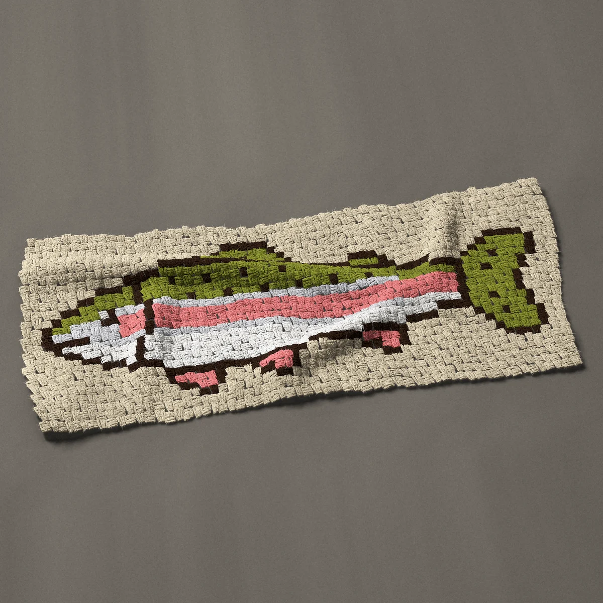 A panel worked corner to corner, 45 by 19½ inches: Rainbow trout in side view with a pink stripe, 60 by 26 blocks