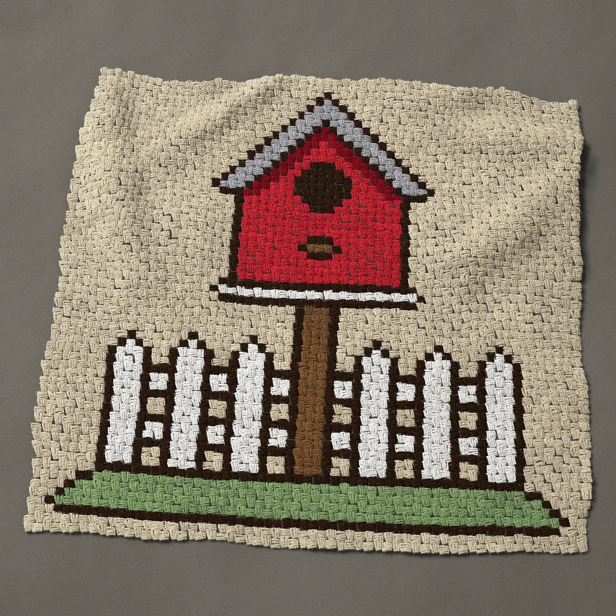 A panel worked corner to corner, 45½ by 44 inches: Red bird house on a white picket fence, 61 by 59 blocks