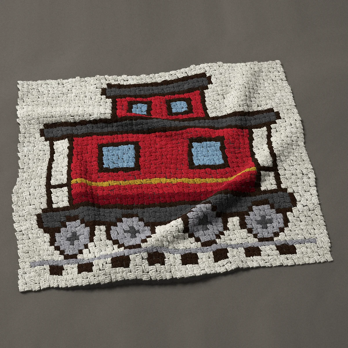 A baby blanket worked corner to corner, 42½ by 36¾ inches: Red caboose train car on the track, 57 by 49 blocks