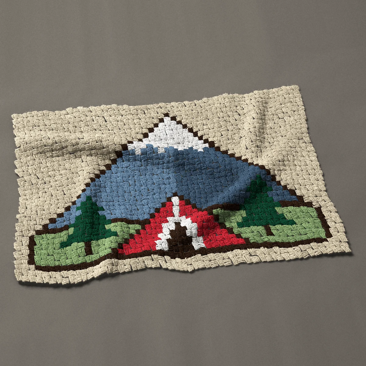 A baby blanket worked corner to corner, 39½ by 26¼ inches: Red camping tent below a snowy mountain with pines, 53 by 35 blocks