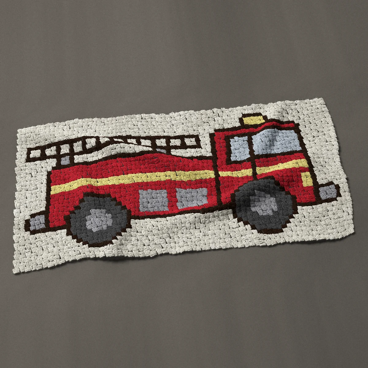 A baby blanket worked corner to corner, 51 by 27 inches: Red fire engine with a ladder on top, a fire truck, 68 by 36 blocks