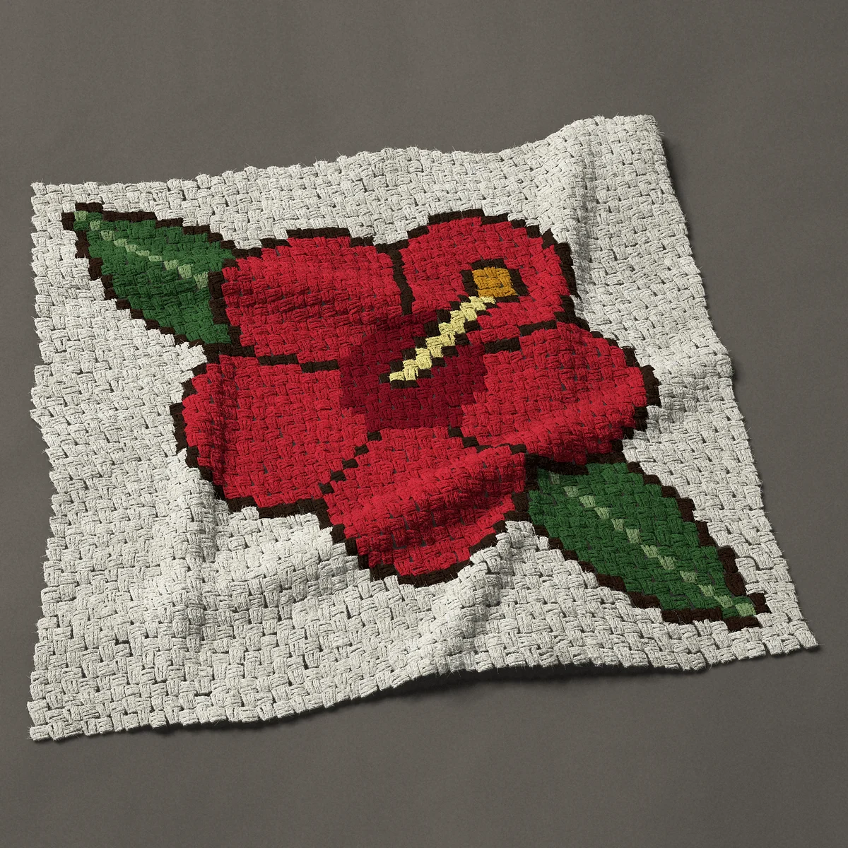 A baby blanket worked corner to corner, 39 by 37½ inches: Red hibiscus flower, a Hawaiian flower with two leaves, 52 by 50 blocks