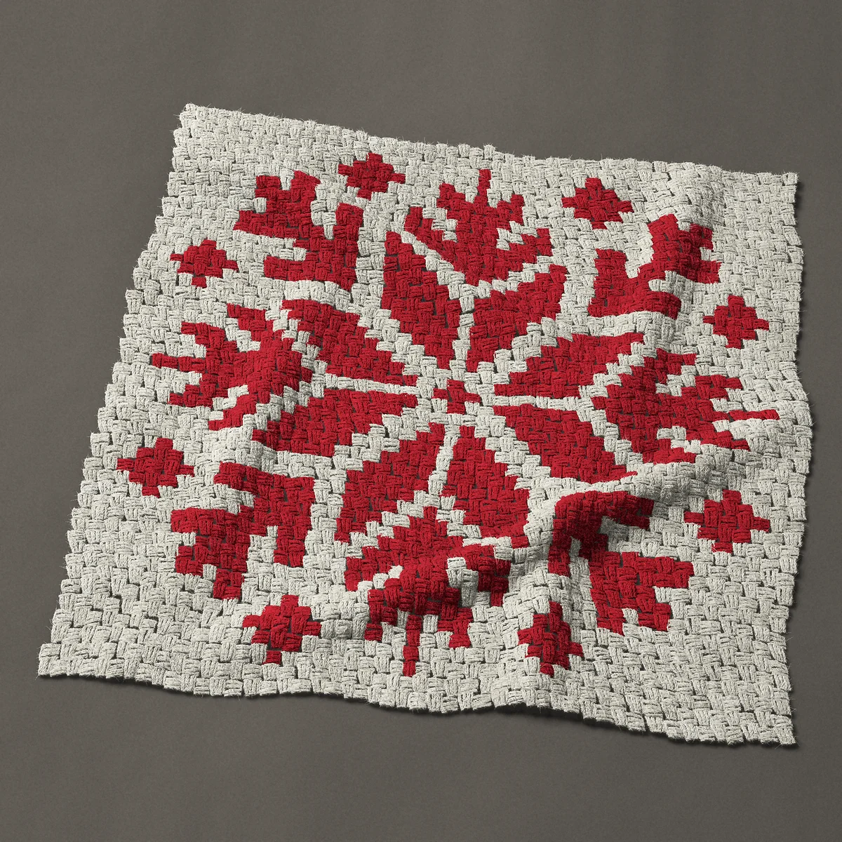 A baby blanket worked corner to corner, 36¾ by 36¾ inches: Red Nordic snowflake in a single color, 49 by 49 blocks