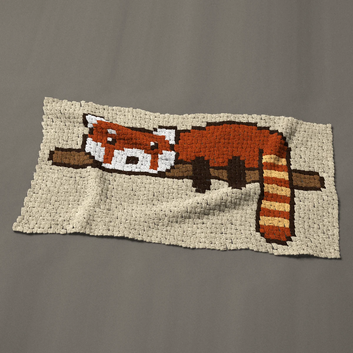 A baby blanket worked corner to corner, 50 by 26¼ inches: Red panda on a branch with its ringed tail hanging down, 67 by 35 blocks