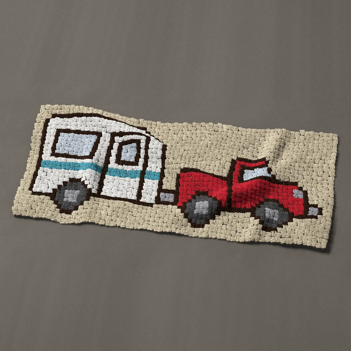 A panel worked corner to corner, 50 by 22½ inches: Red pickup truck towing a white camper travel trailer, 67 by 30 blocks