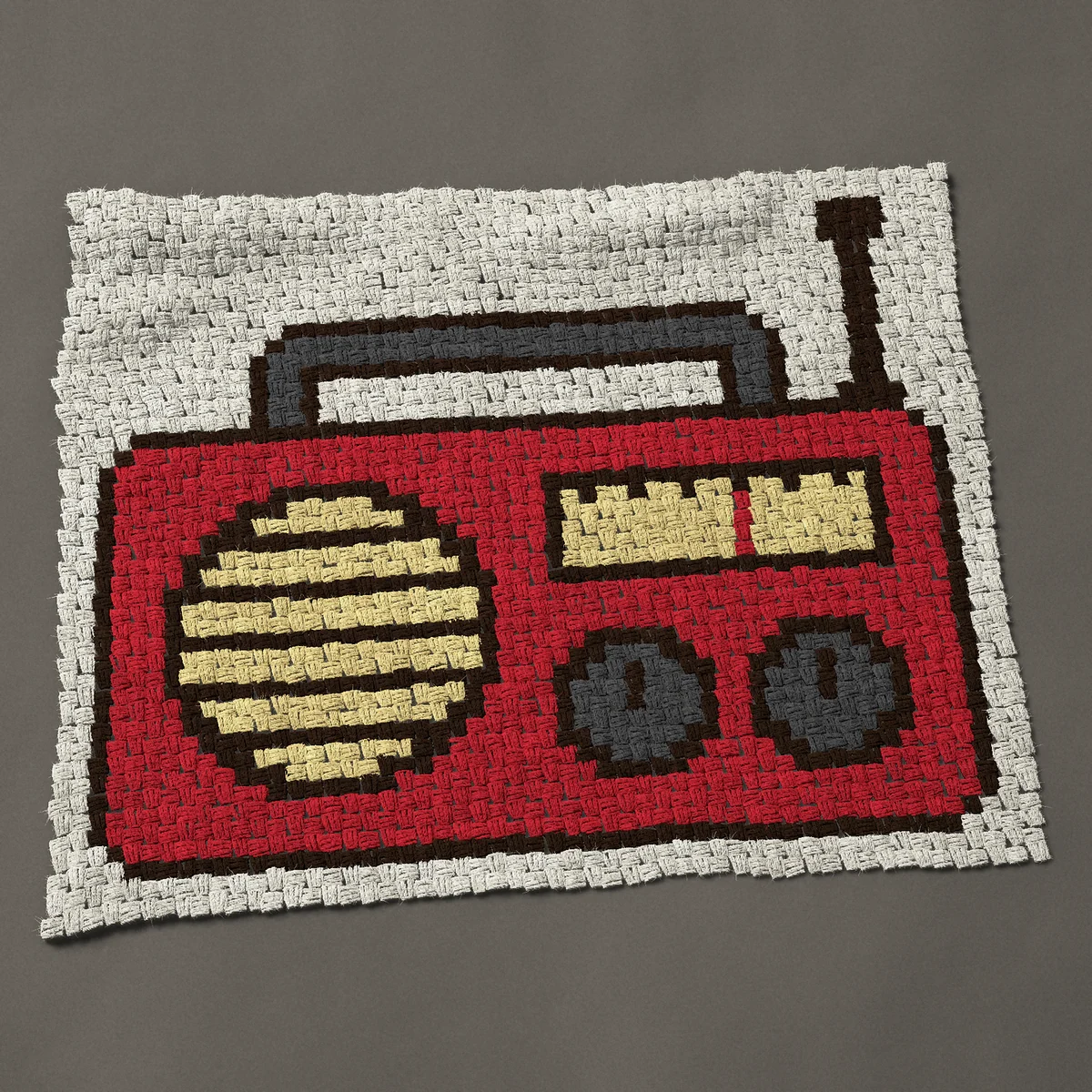 A baby blanket worked corner to corner, 40½ by 33¾ inches: Red retro portable radio with a handle and antenna, 54 by 45 blocks