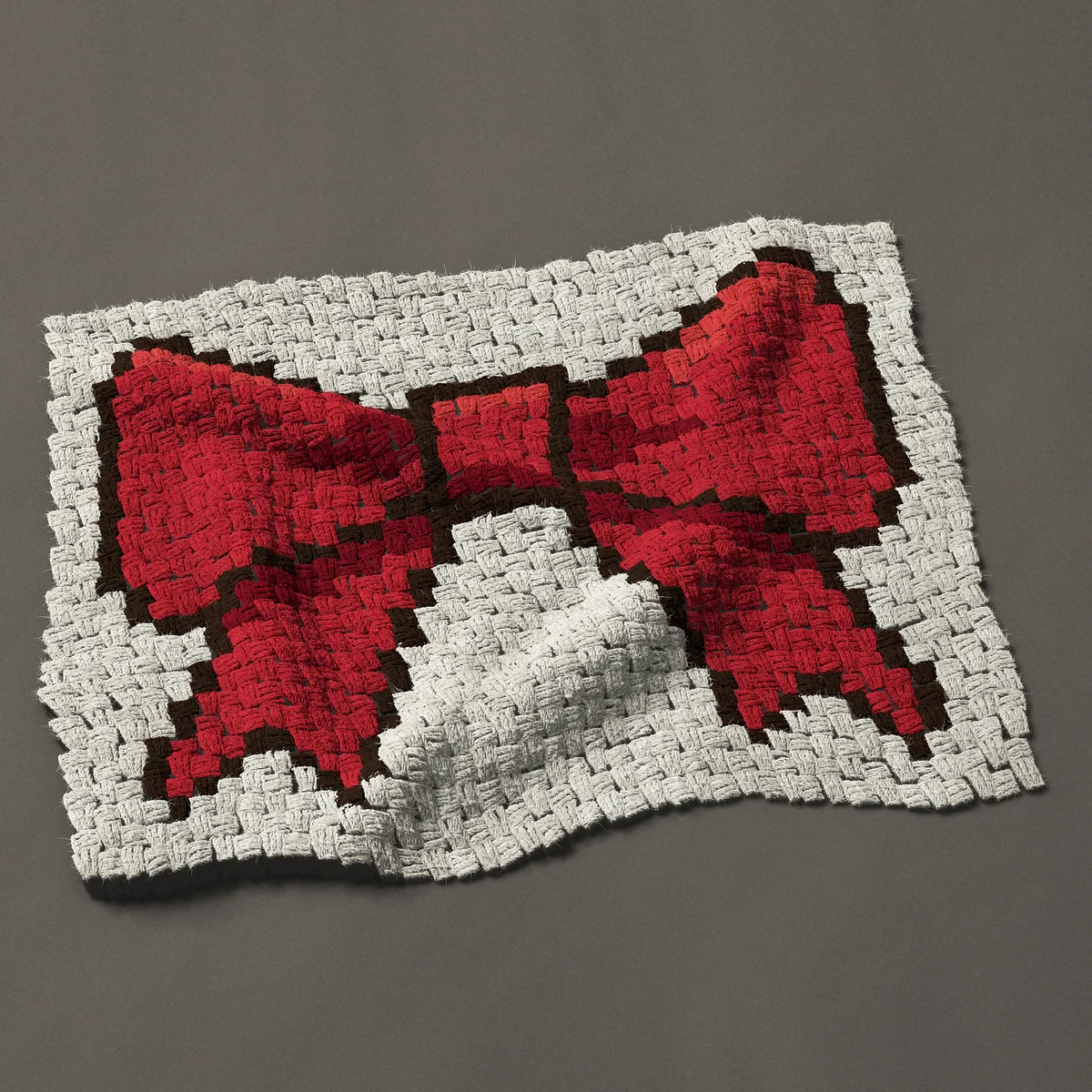A panel worked corner to corner, 30¾ by 23¼ inches: Red ribbon bow with two tails, 41 by 31 blocks