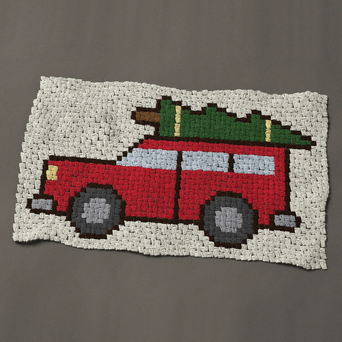 A baby blanket worked corner to corner, 44 by 26¼ inches: Red station wagon with a Christmas tree on top, 59 by 35 blocks