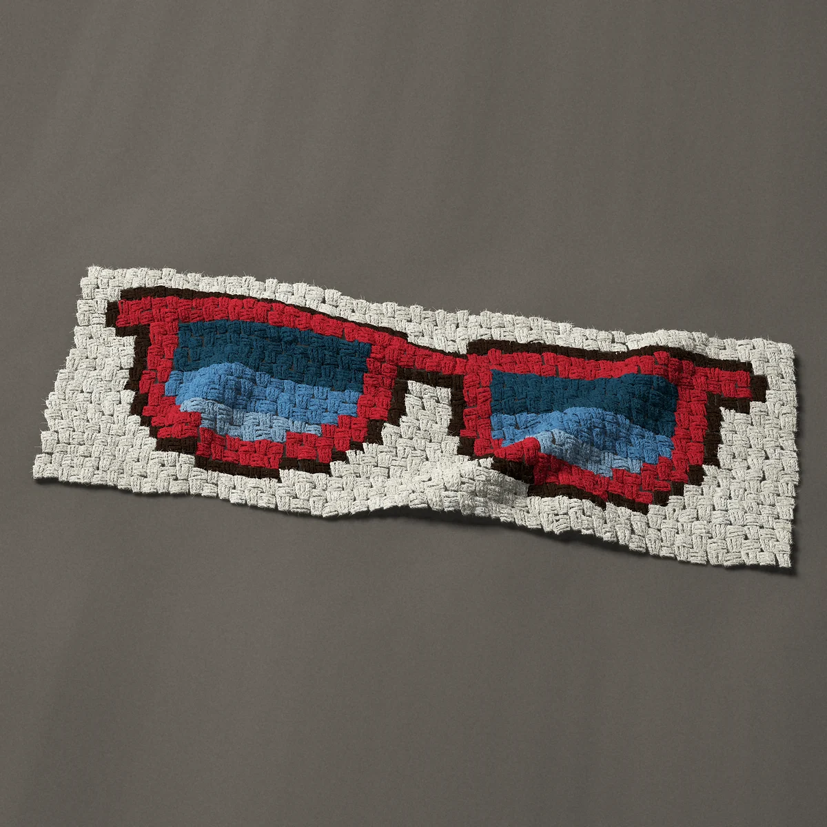 A panel worked corner to corner, 39½ by 14¼ inches: Red sunglasses with blue lenses for summer, 53 by 19 blocks
