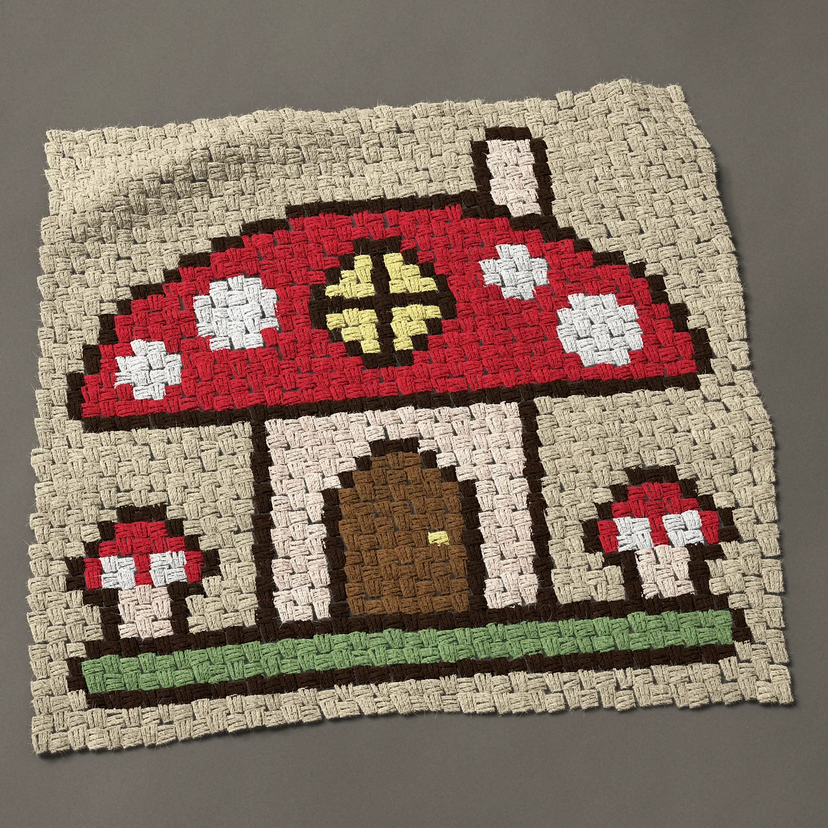 A panel worked corner to corner, 32¼ by 30¾ inches: Toadstool fairy house, a red mushroom cottage, 43 by 41 blocks