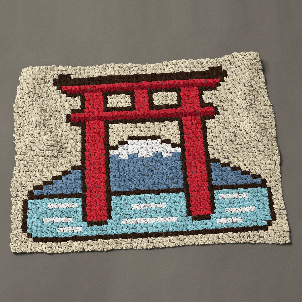 A baby blanket worked corner to corner, 41 by 31½ inches: Red Japanese torii gate with a snow-capped mountain, 55 by 42 blocks